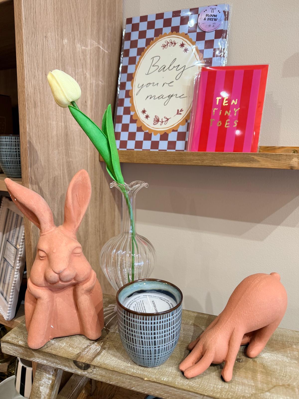 Decor display with rabbit ornaments and greeting cards